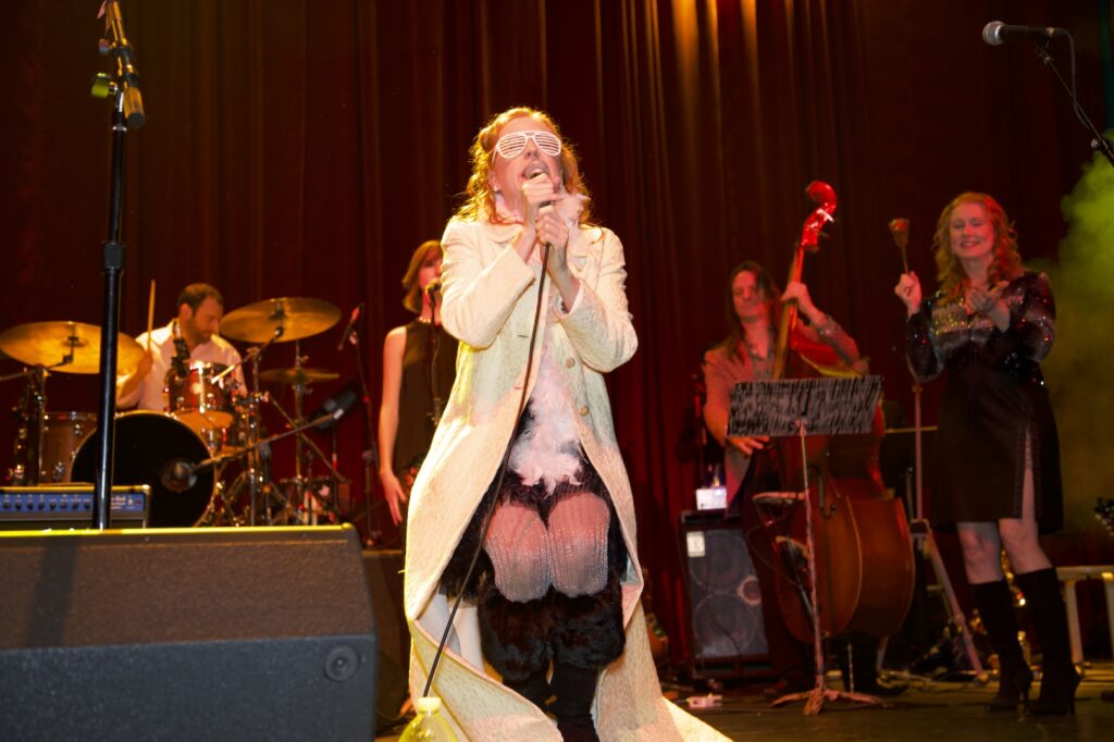 Singer/Songwriter Kelly Brown, producer of The Local Honey Holiday Mix on stage as Snow Miser from the song "Heat Miser".